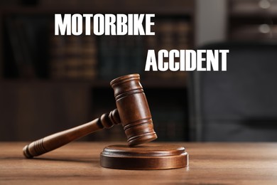 Image of Motorbike accident law. Wooden judge's gavel on table