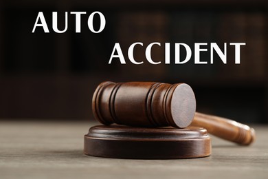 Image of Auto accident law. Wooden judge's gavel on table