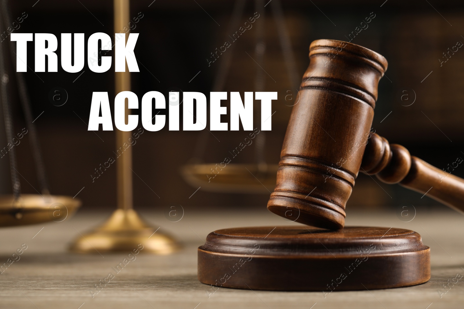 Image of Truck accident law. Wooden judge's gavel and scales of justice on table