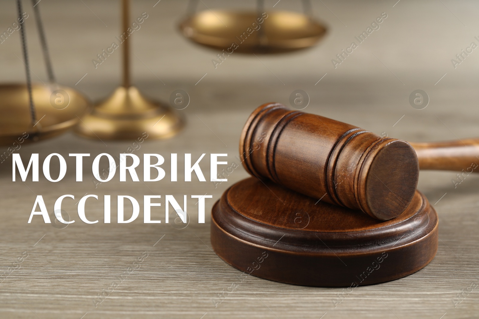 Image of Motorbike accident law. Wooden judge's gavel on table