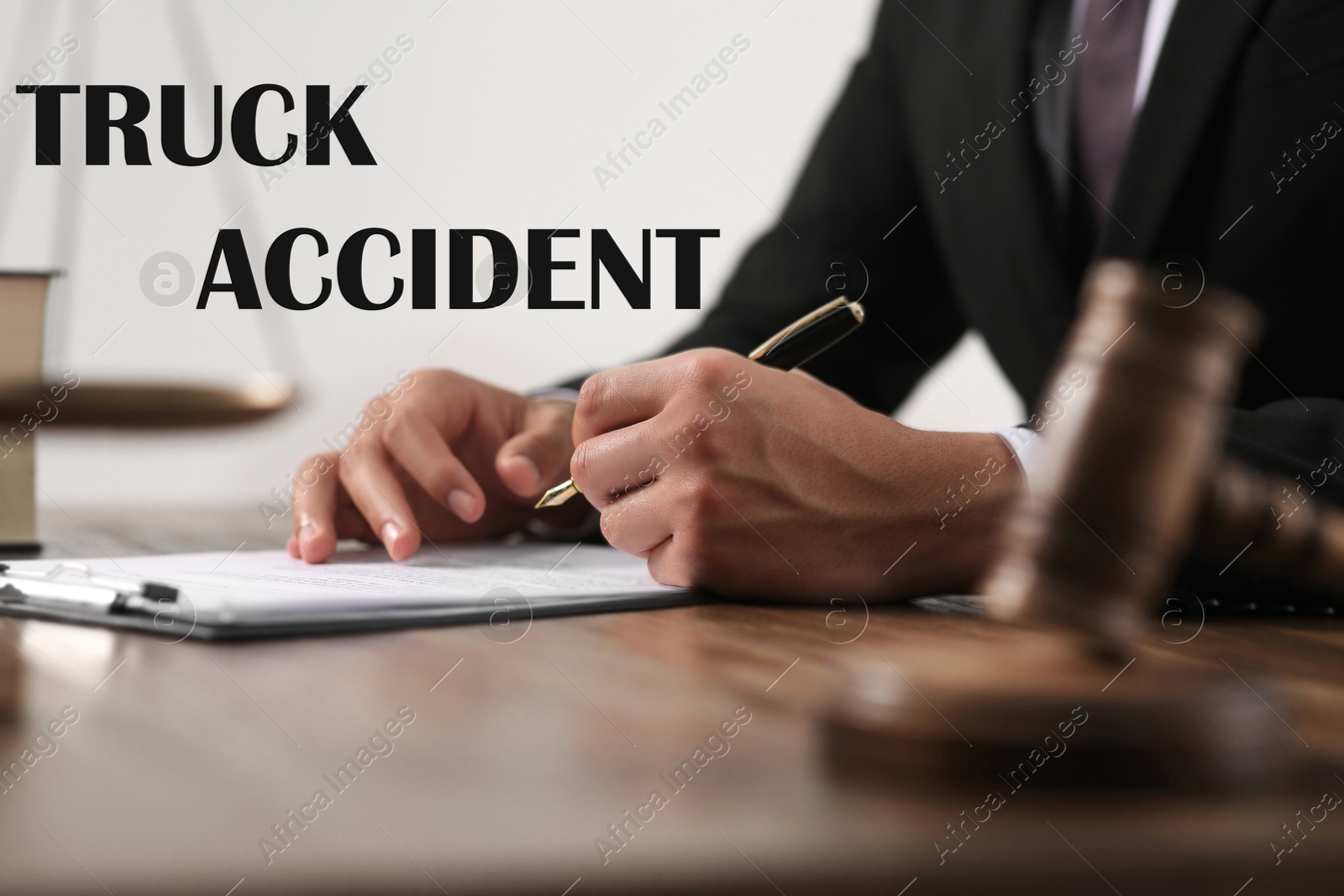 Image of Truck accident law. Judge working at wooden table, closeup