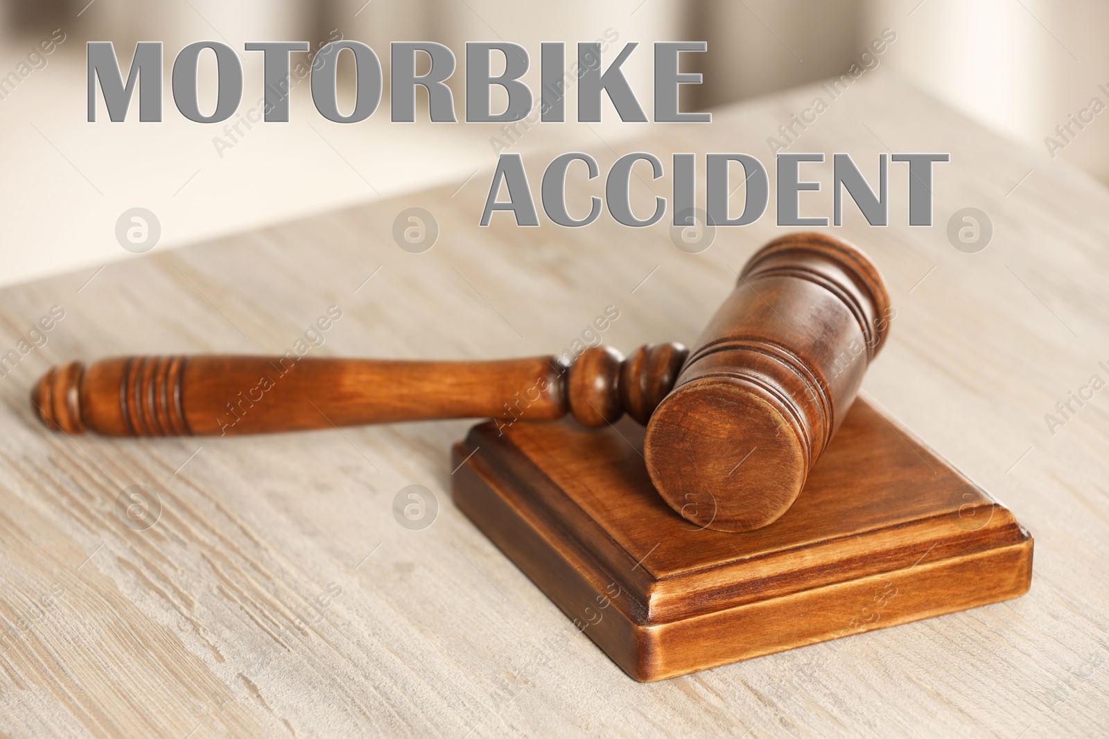 Image of Motorbike accident law. Judge's gavel on wooden table