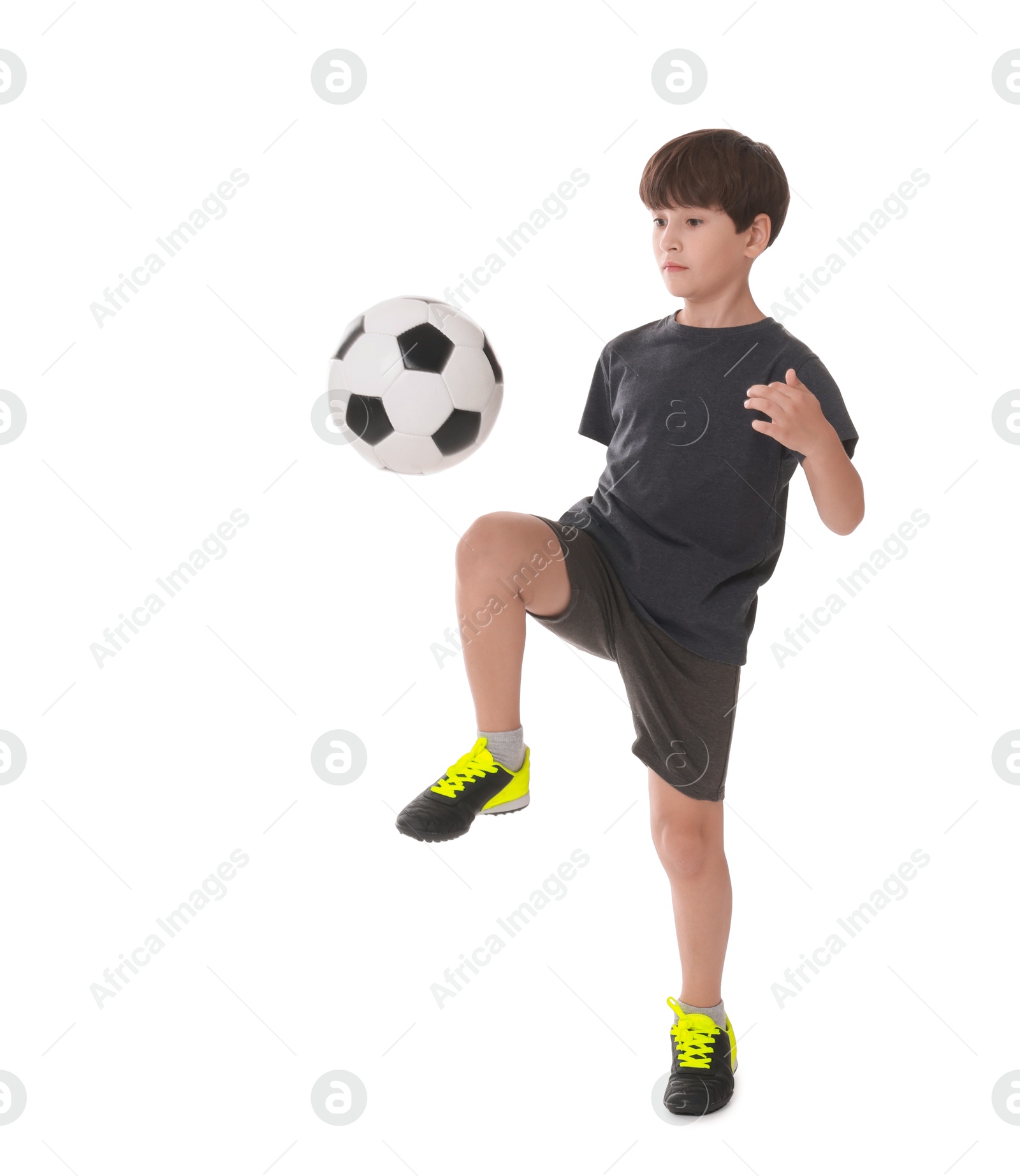 Photo of Boy with soccer ball playing football on white background