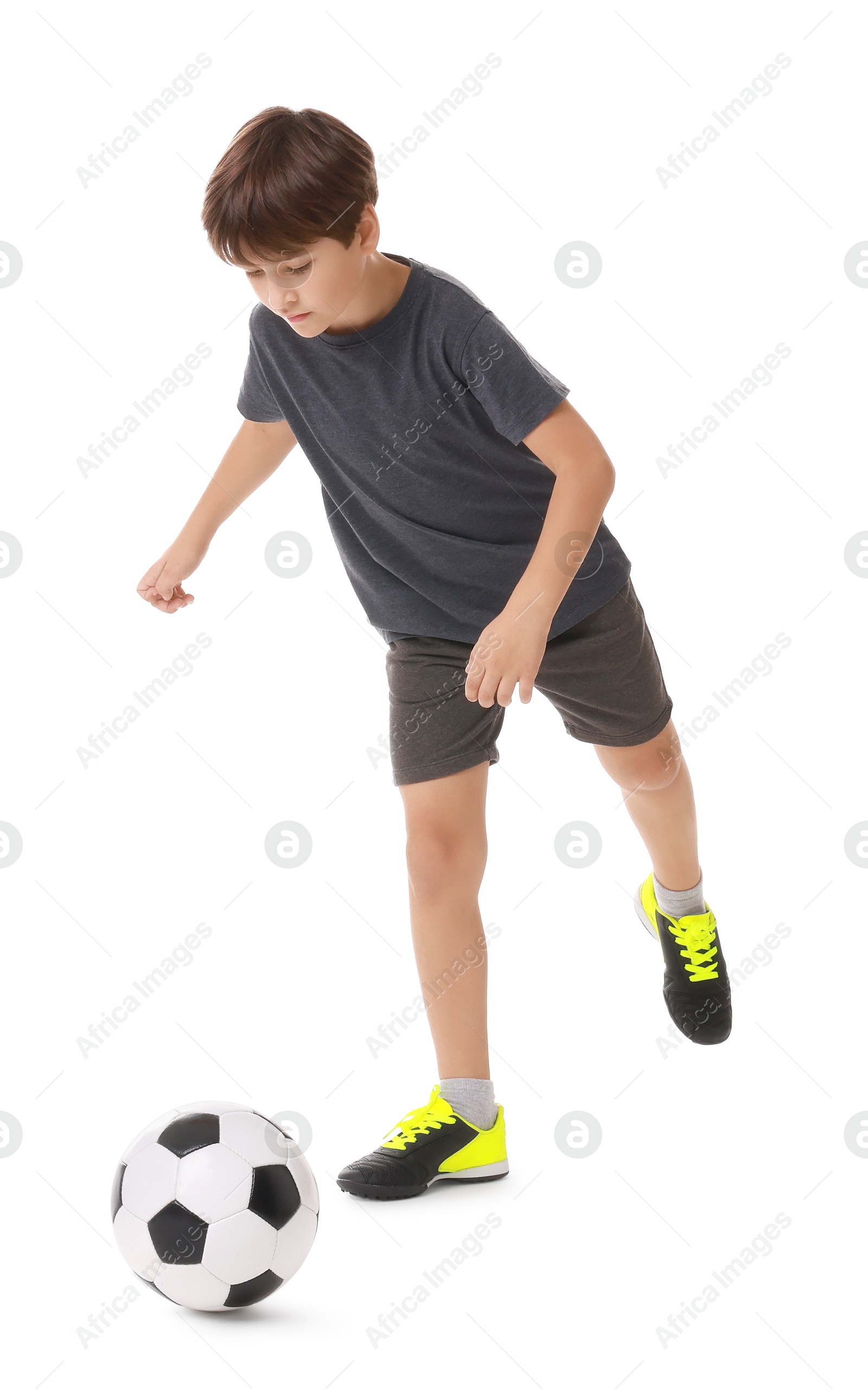 Photo of Boy with soccer ball playing football on white background