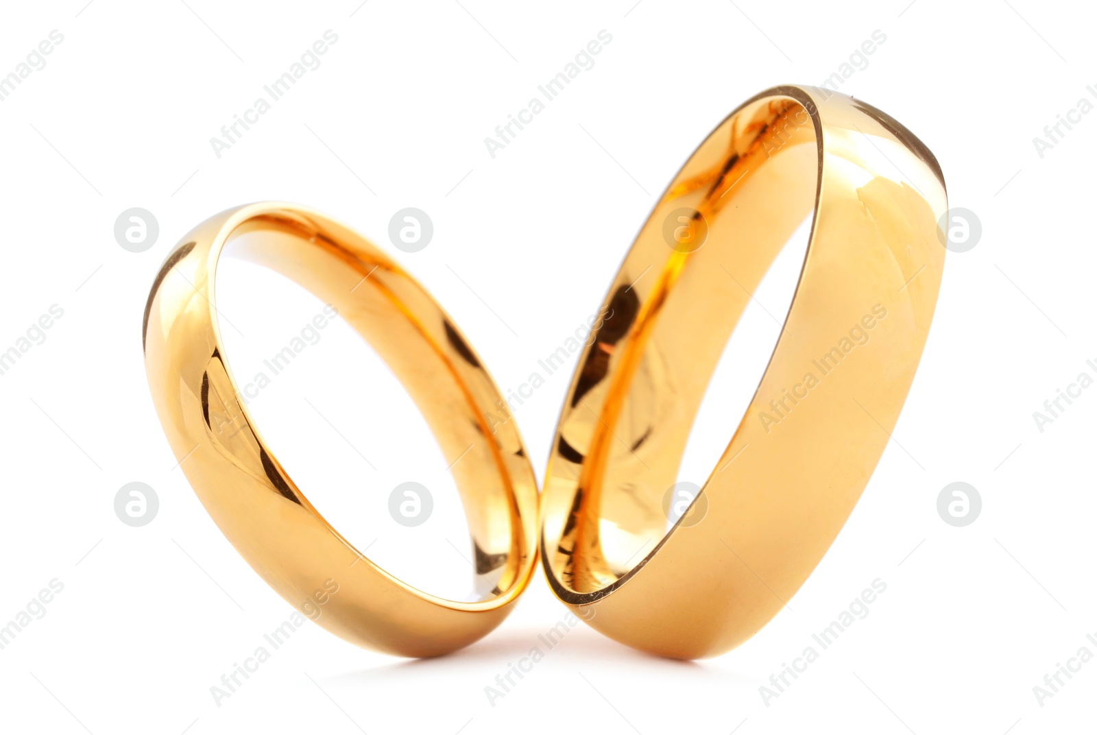 Photo of Beautiful golden wedding rings isolated on white