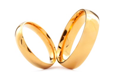 Photo of Beautiful golden wedding rings isolated on white