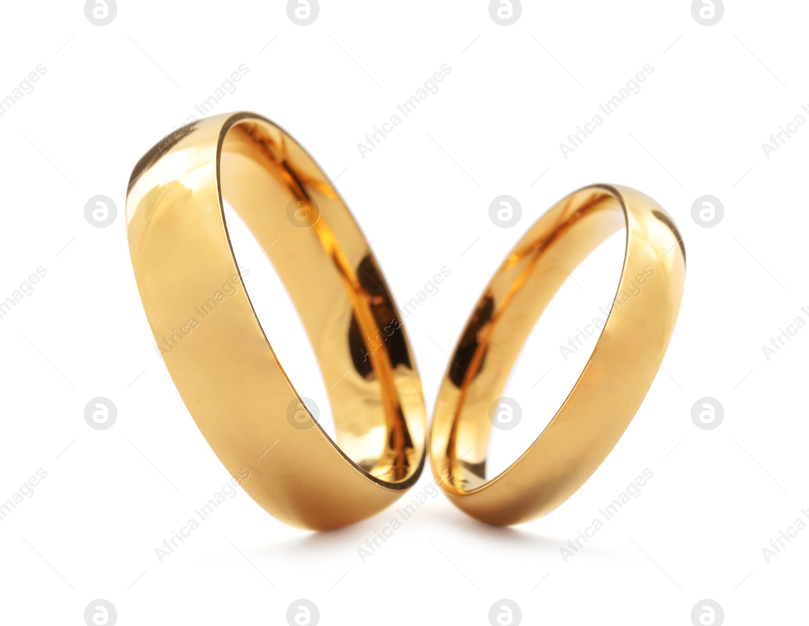 Photo of Beautiful golden wedding rings isolated on white