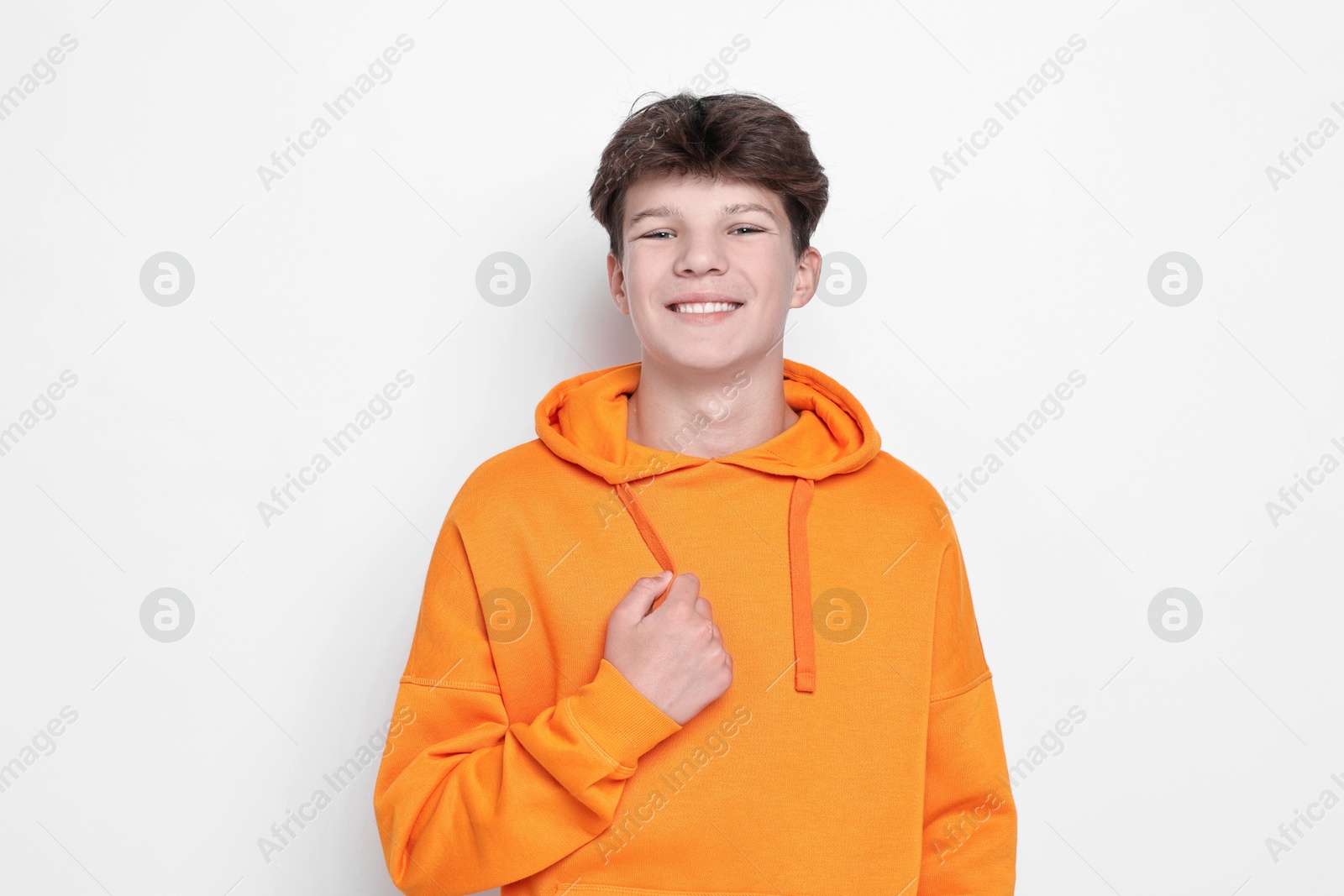 Photo of Portrait of teenage boy on white background