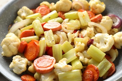 Photo of Tasty cooked vegetables in frying pan, closeup