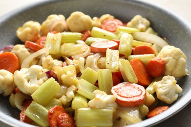 Photo of Tasty cooked vegetables in frying pan, closeup