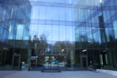 Blurred view of modern building with many windows outdoors