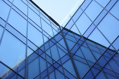 Photo of Exterior of modern building with many windows outdoors, low angle view