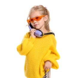 Photo of Cute little girl with handset of telephone on white background