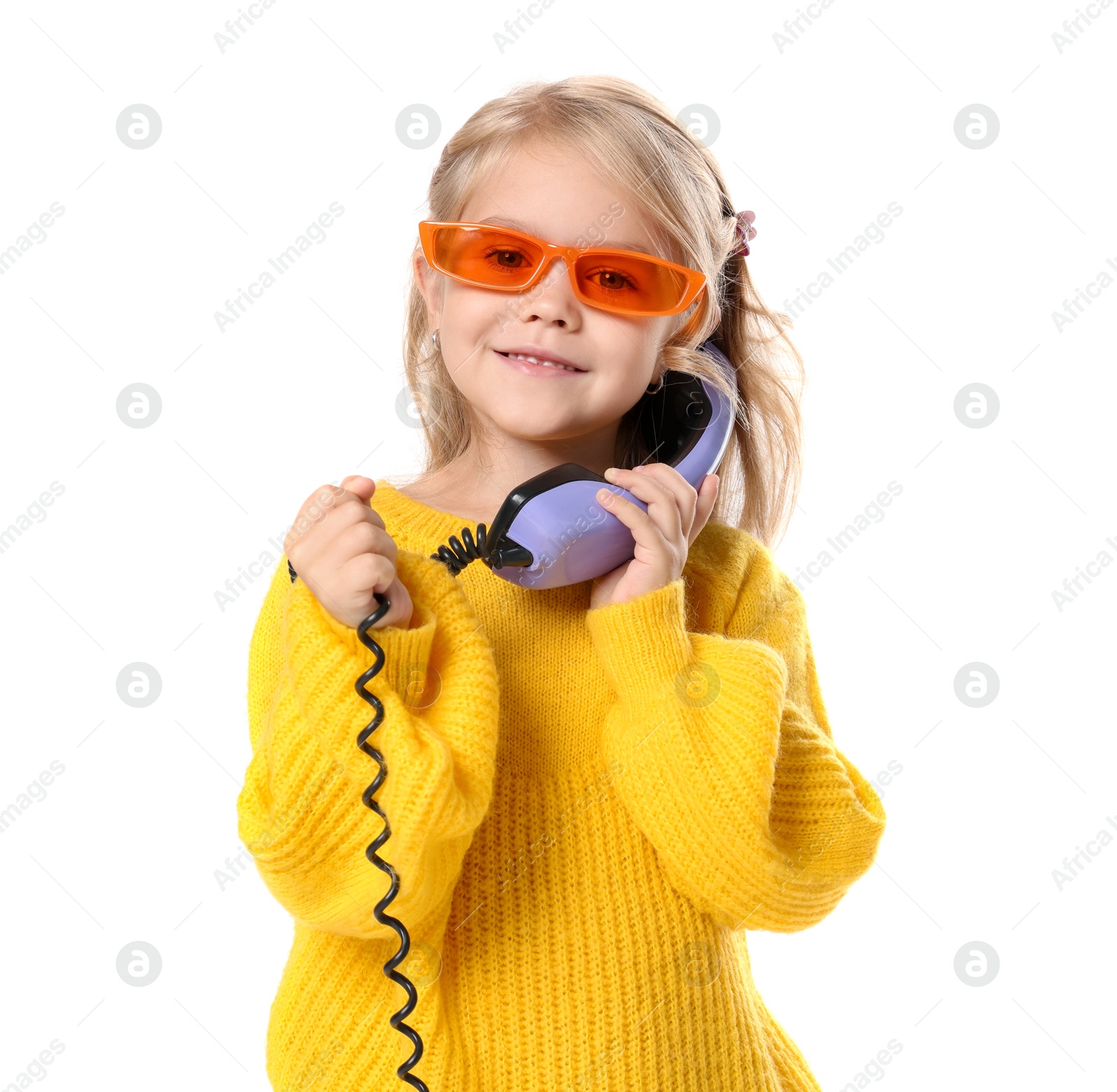 Photo of Cute little girl with handset of telephone on white background