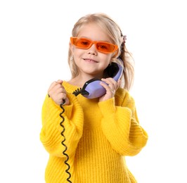 Photo of Cute little girl with handset of telephone on white background