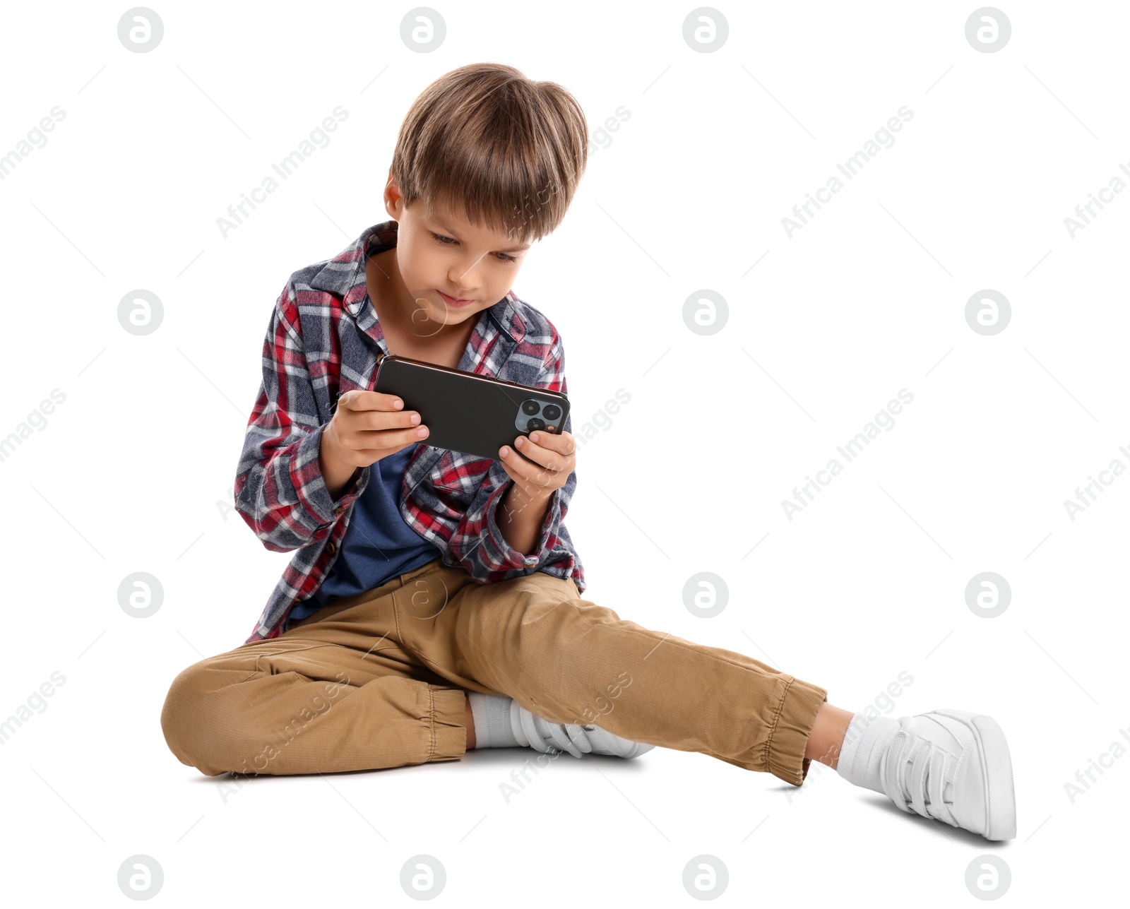 Photo of Cute little boy with smartphone on white background