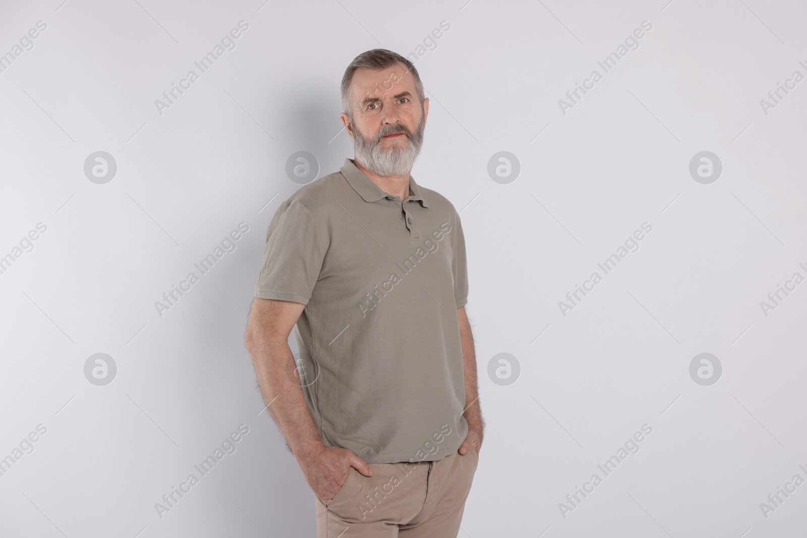 Photo of Portrait of senior man on white background