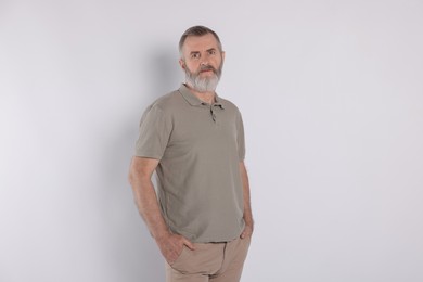 Photo of Portrait of senior man on white background