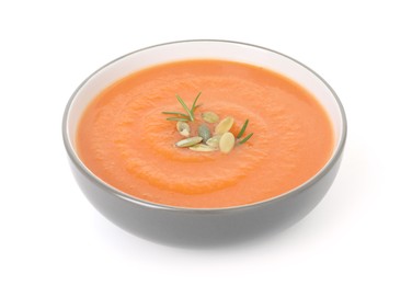 Photo of Delicious sweet potato soup with pumpkin seeds in bowl isolated on white