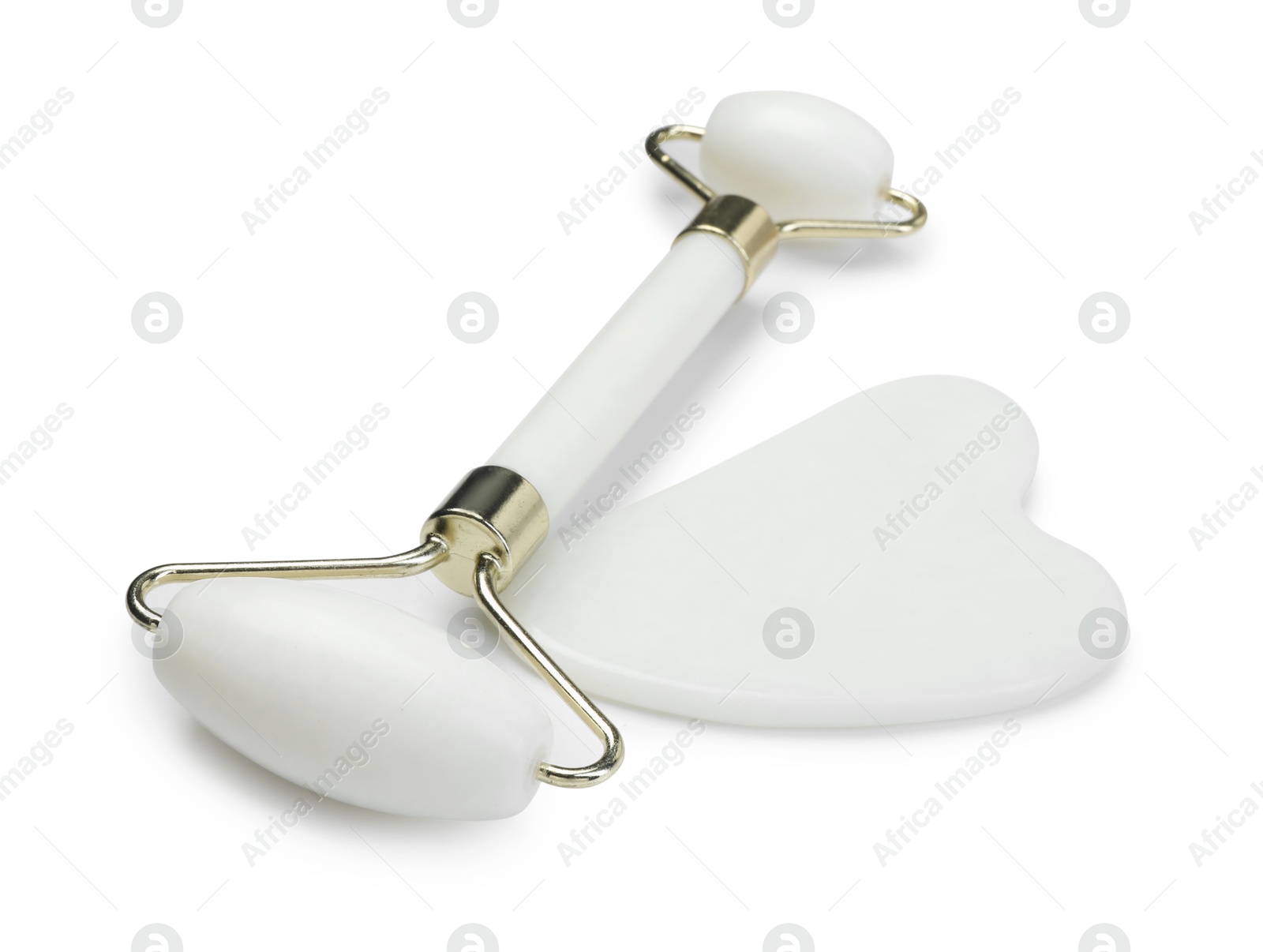 Photo of Face roller and gua sha tool isolated on white