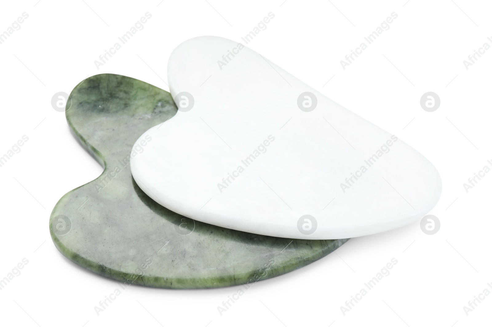 Photo of Different gua sha tools isolated on white