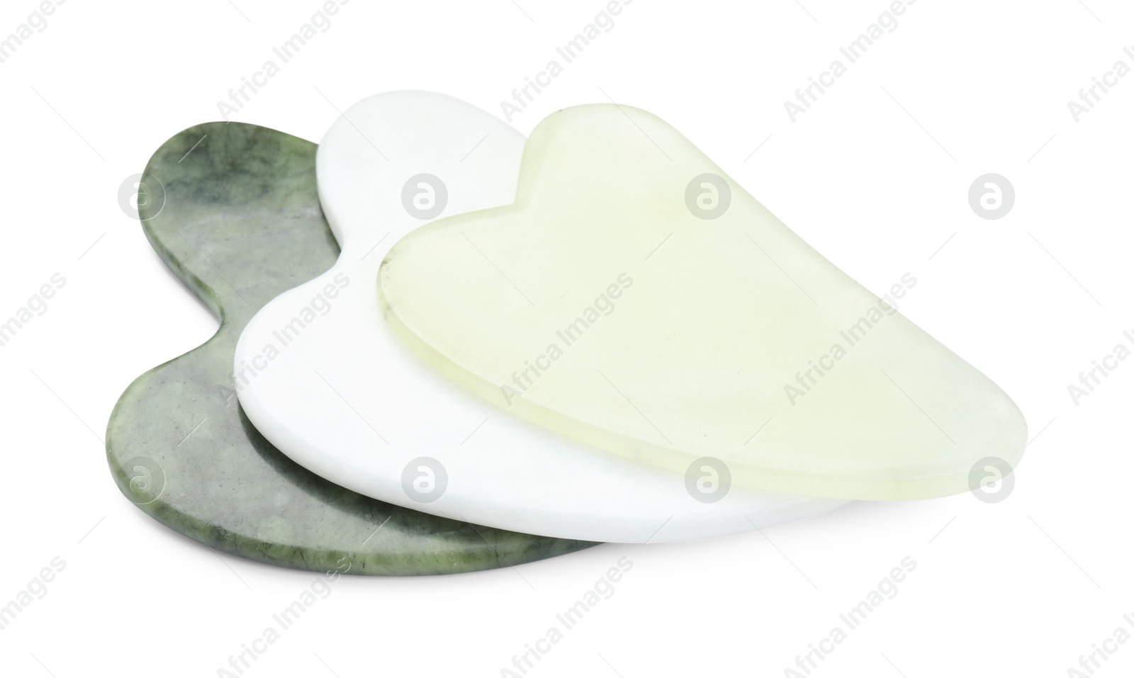 Photo of Different gua sha tools isolated on white