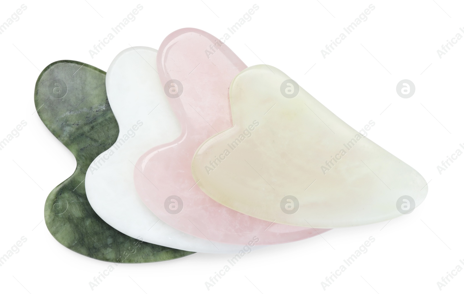 Photo of Different gua sha tools isolated on white, top view