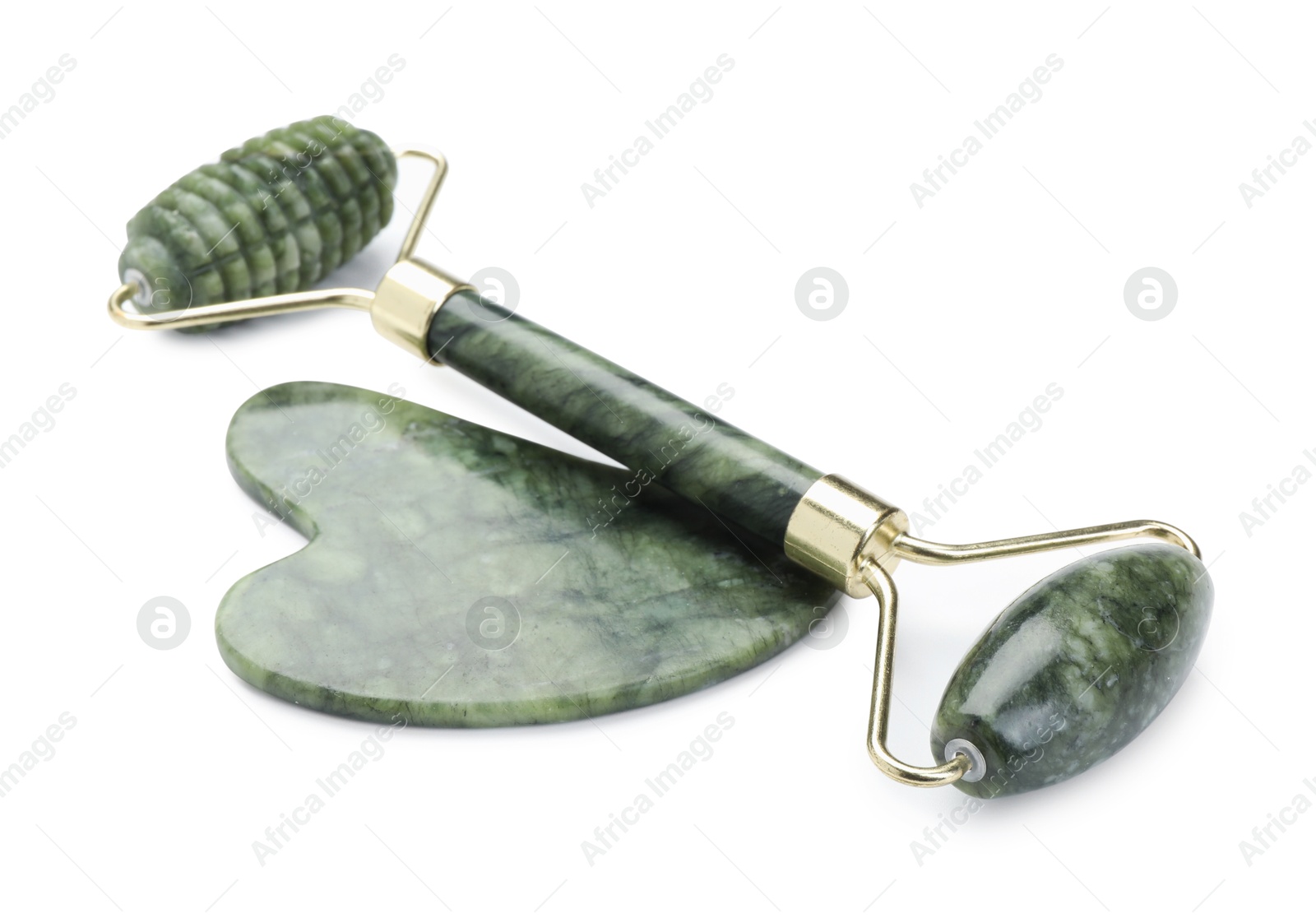 Photo of Face roller and gua sha tool isolated on white