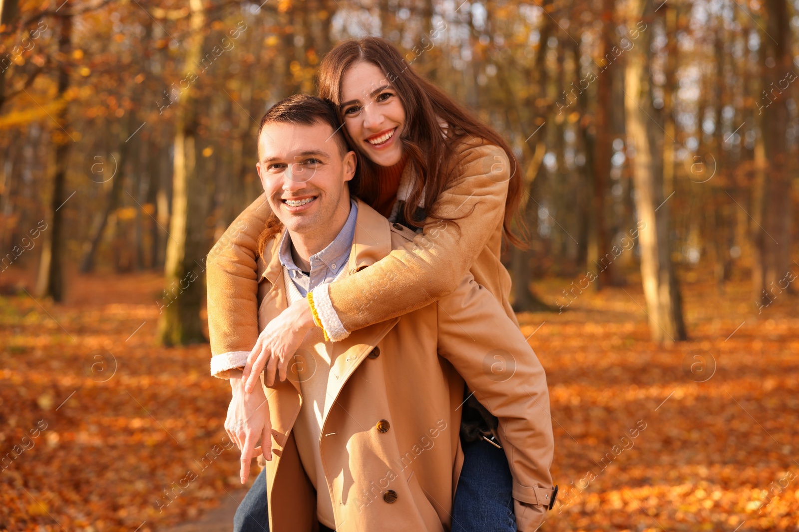 Photo of Happy couple spending time together in autumn park