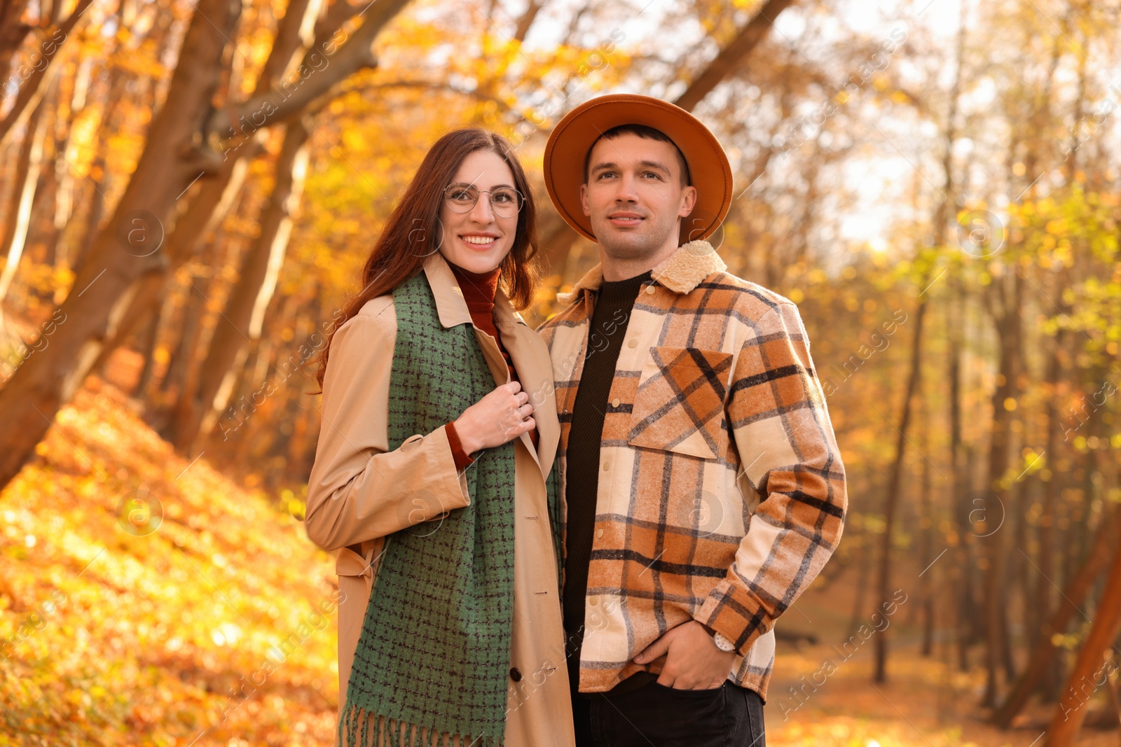 Photo of Happy couple spending time together in autumn park