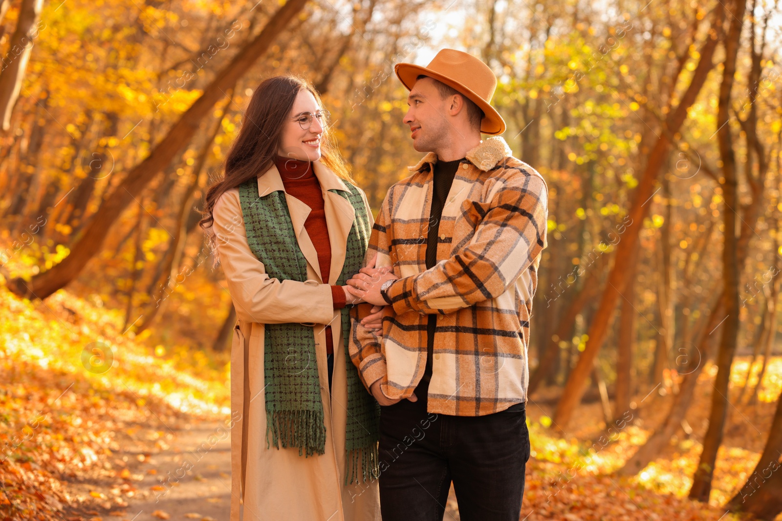 Photo of Happy couple spending time together in autumn park