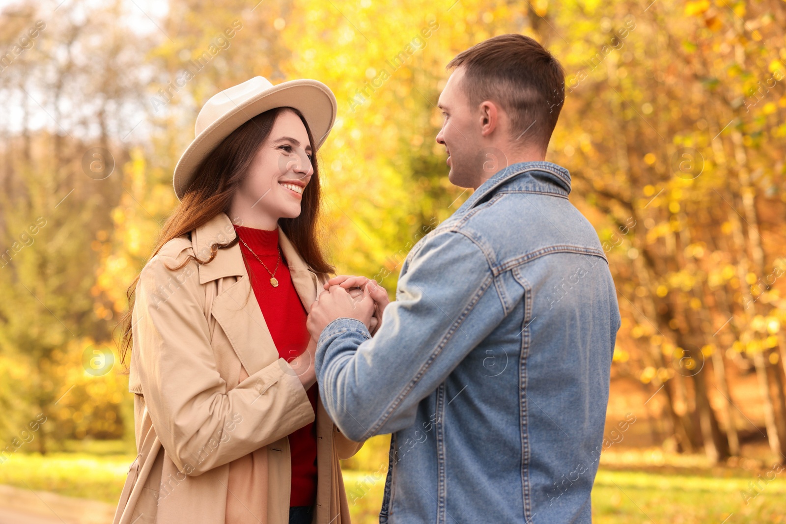 Photo of Happy couple spending time together in autumn park