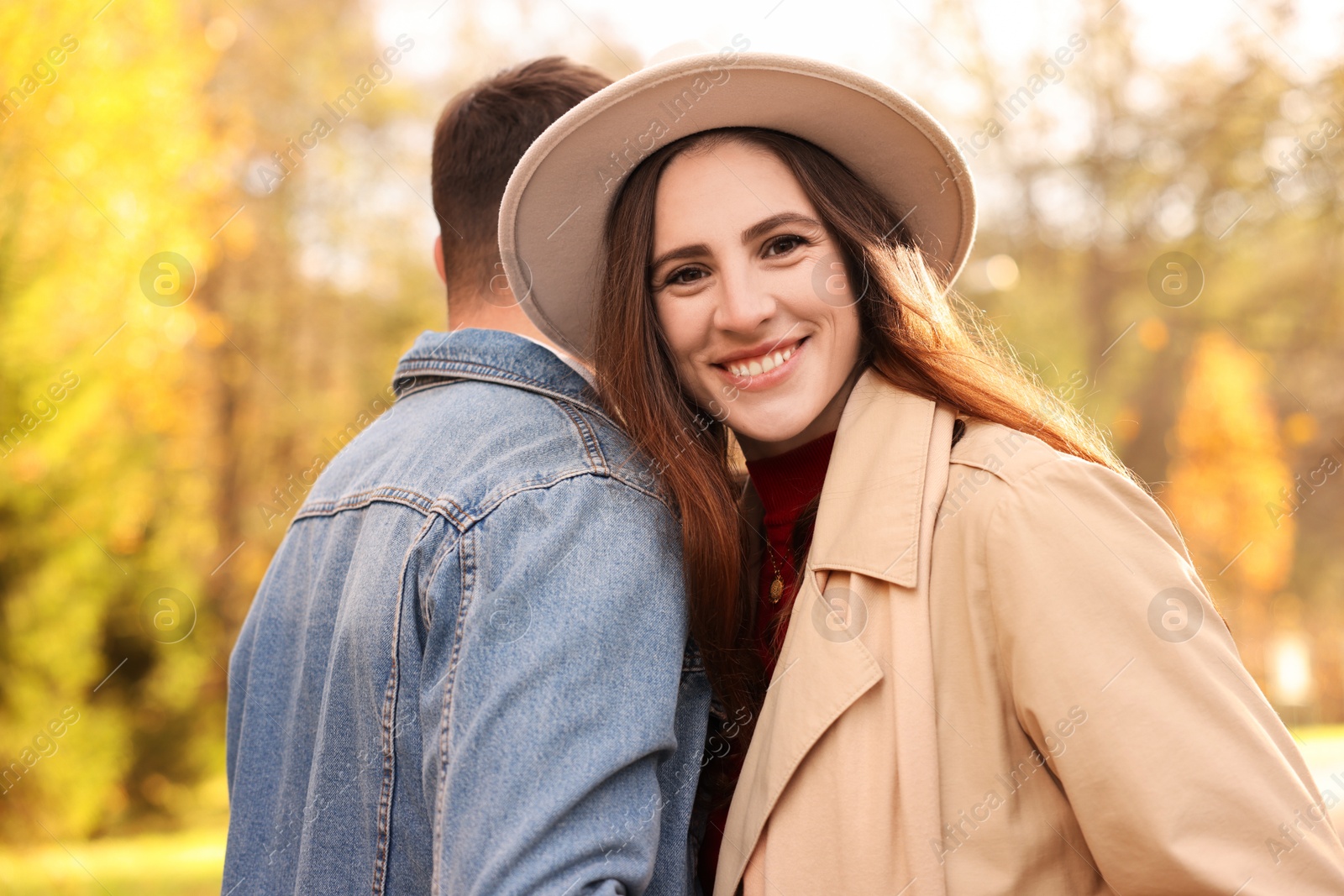 Photo of Happy couple spending time together in autumn park