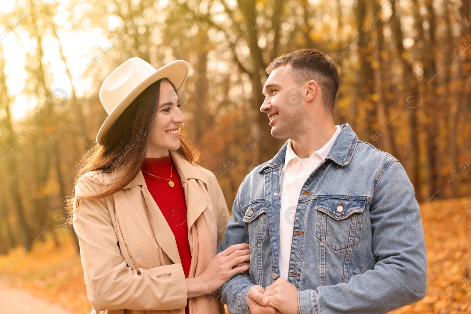 Photo of Happy couple spending time together in autumn park