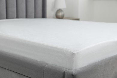 Photo of Bed with clean linens at home, closeup