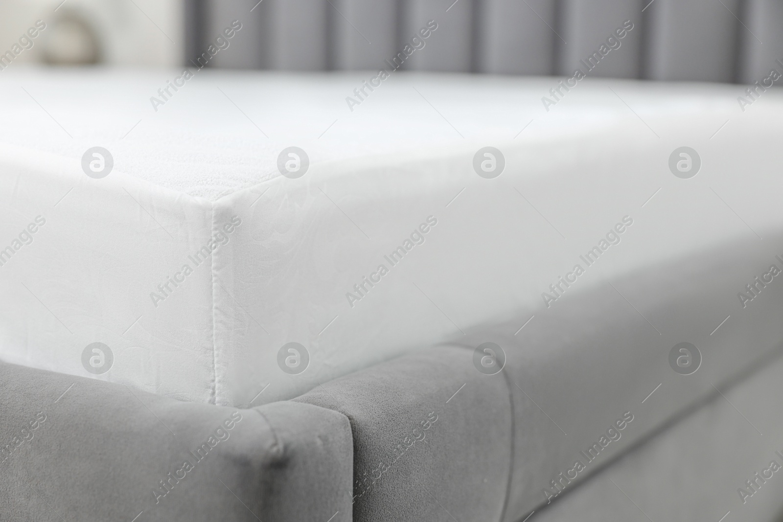 Photo of Bed with clean linens at home, closeup