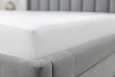 Photo of Bed with clean linens at home, closeup