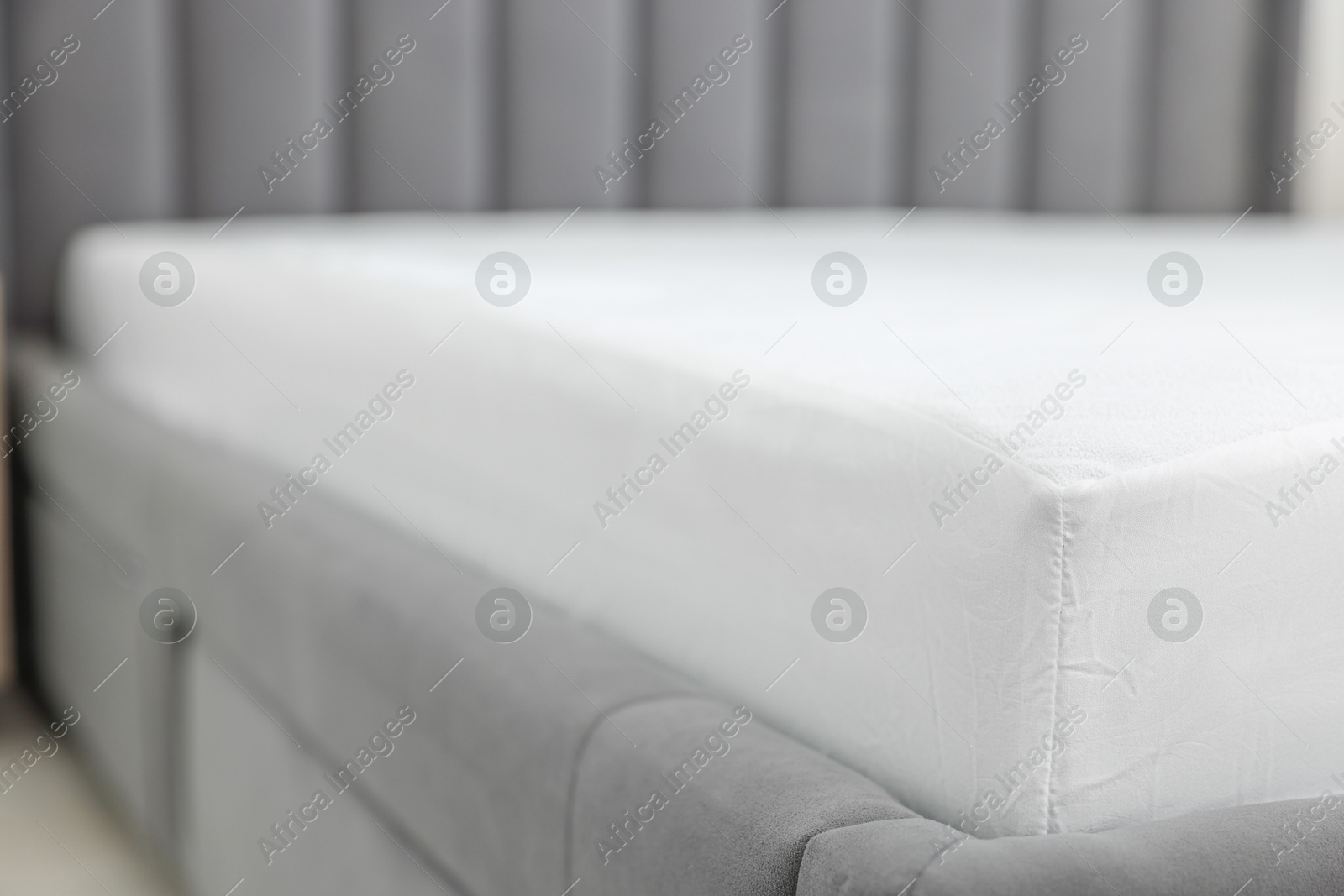 Photo of Bed with clean linens at home, closeup