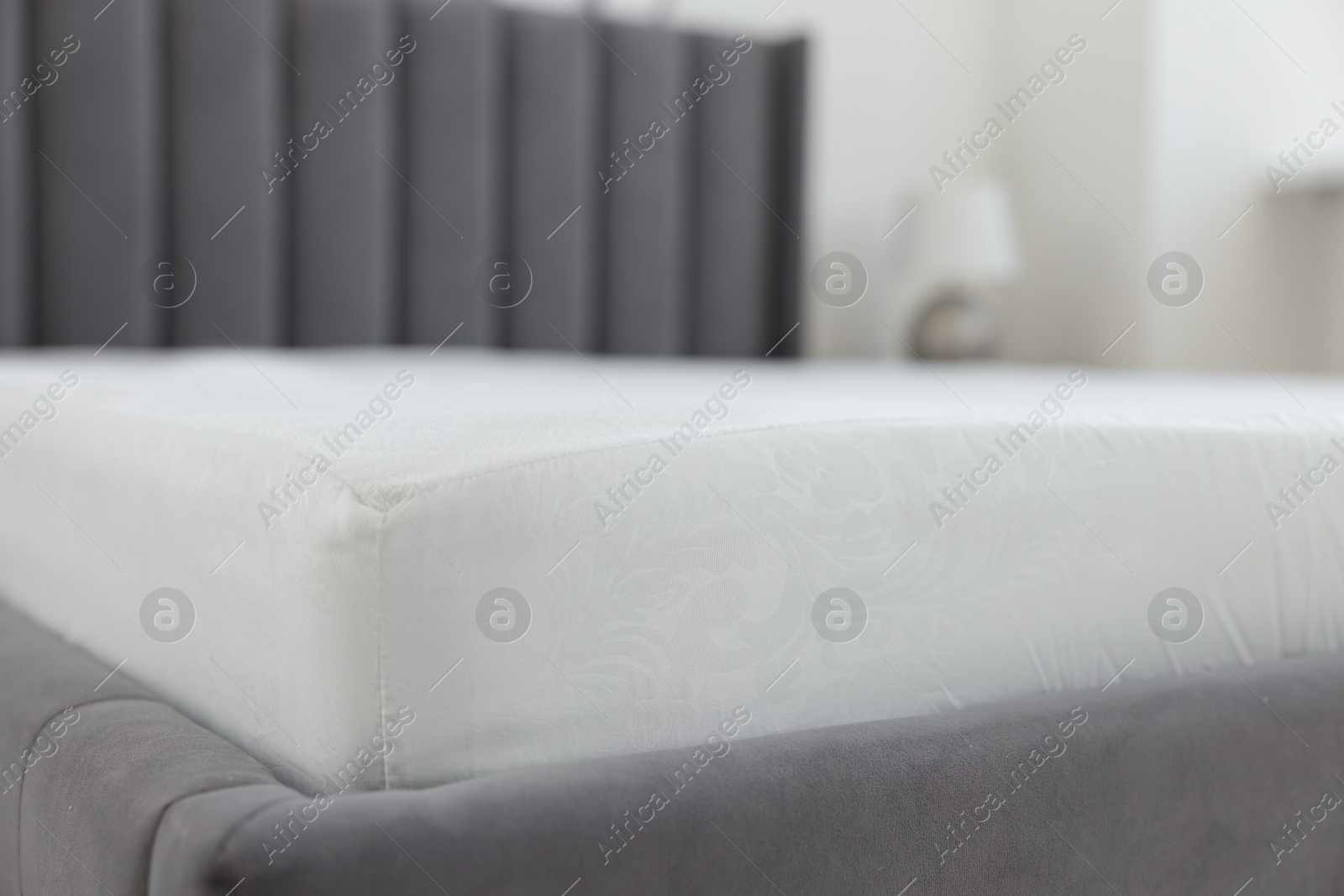 Photo of Bed with clean linens at home, closeup