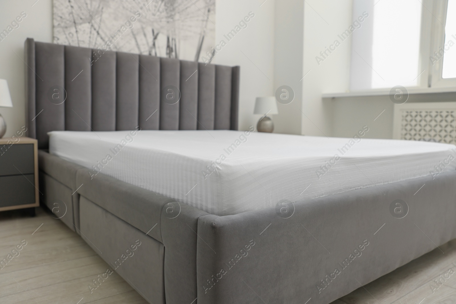 Photo of Bed with clean linens at home, closeup