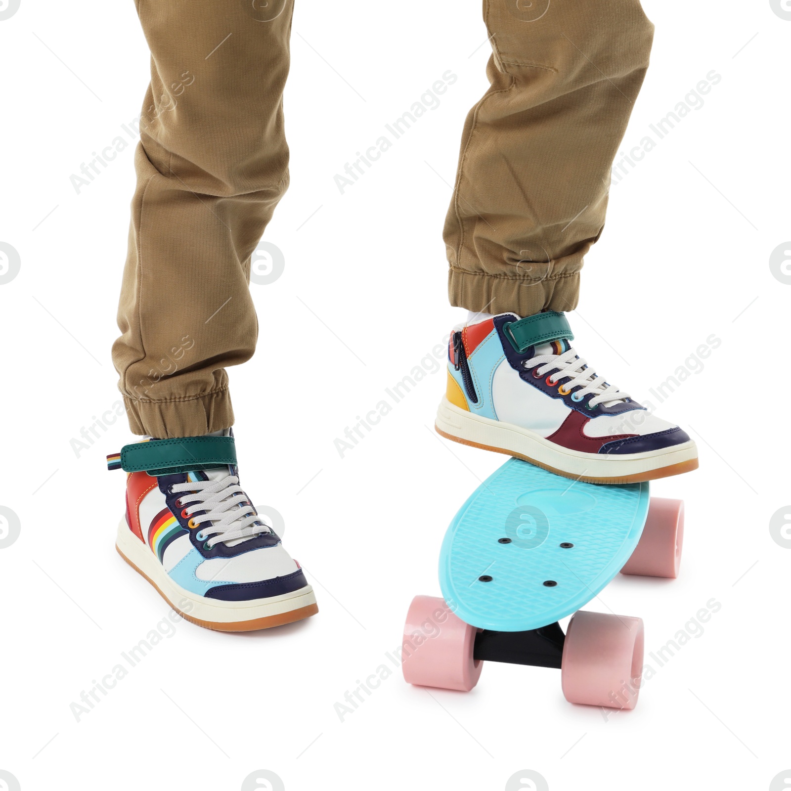 Photo of Little boy with skateboard on white background, closeup