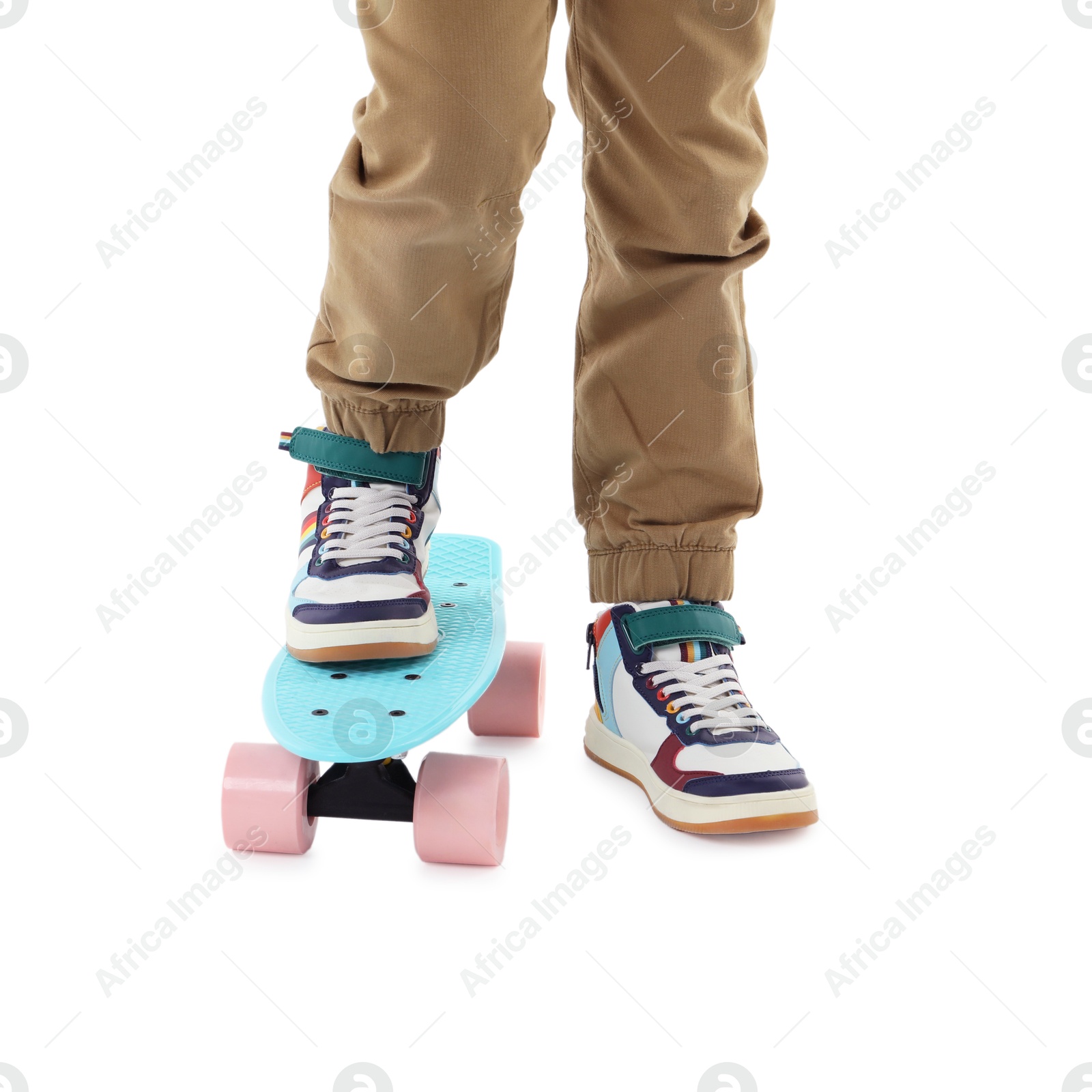 Photo of Little boy with skateboard on white background, closeup