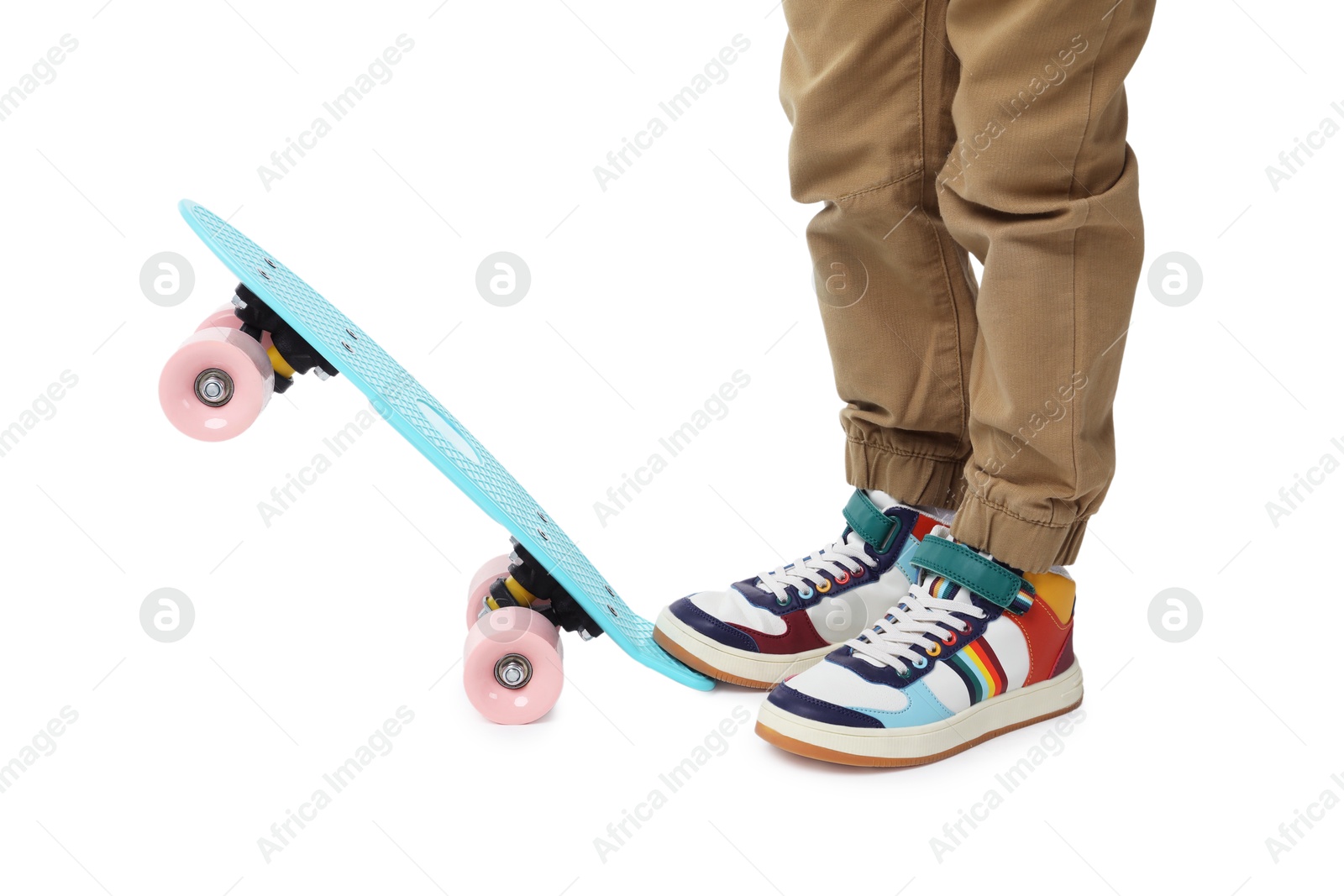 Photo of Little boy with skateboard on white background, closeup