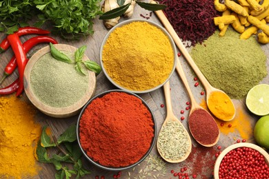 Photo of Different aromatic spices and herbs on wooden background, flat lay