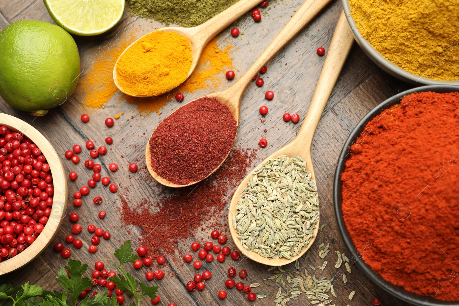 Photo of Different aromatic spices and herbs on wooden background, flat lay