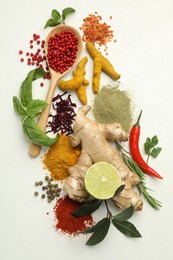 Photo of Different aromatic spices, lime and herbs on white background, flat lay