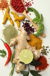 Photo of Different aromatic spices, lime and herbs on white background, flat lay