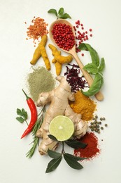 Photo of Different aromatic spices, lime and herbs on white background, flat lay