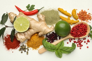 Photo of Different aromatic spices, lime and herbs on white background, flat lay