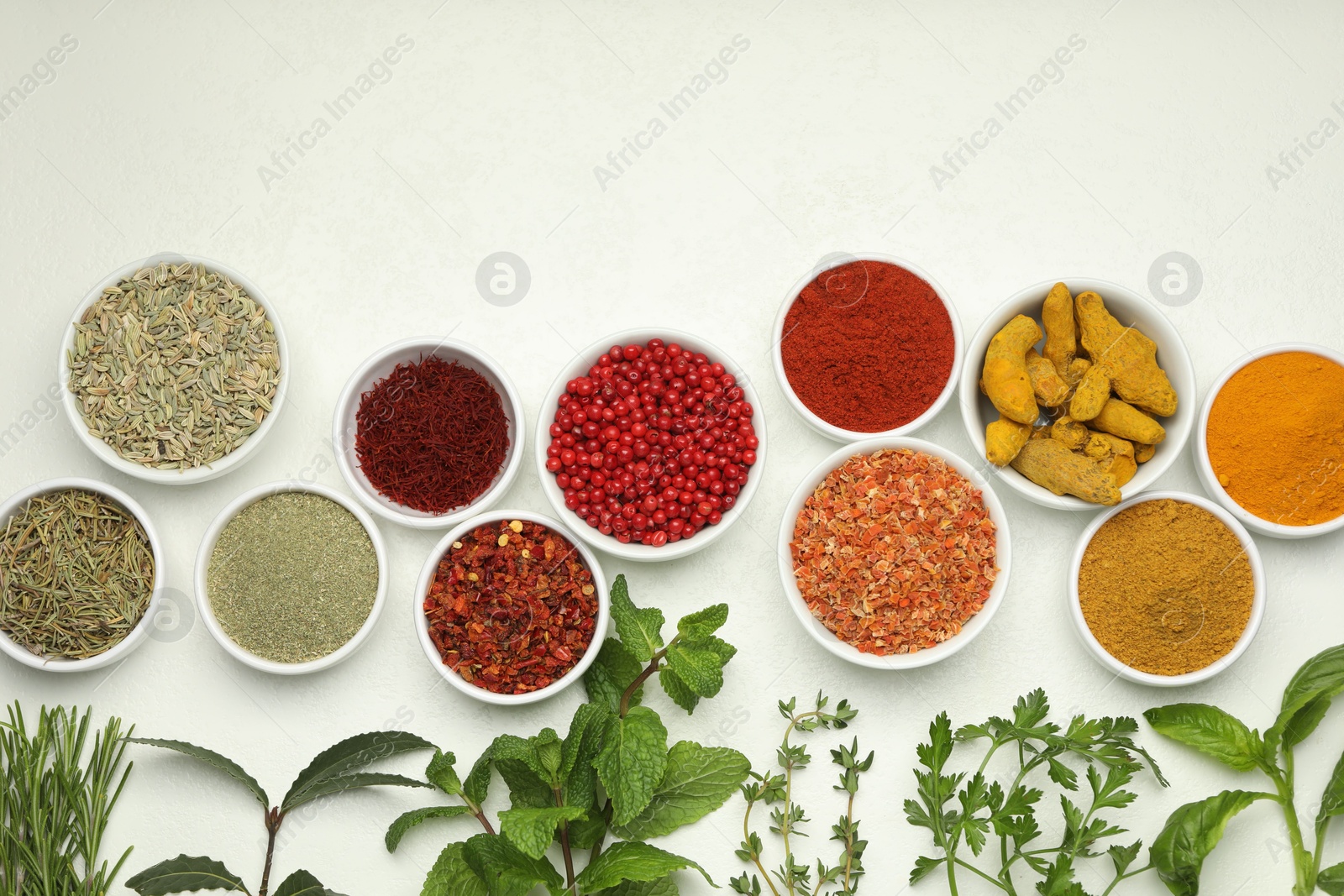 Photo of Different aromatic spices and herbs on white background, flat lay